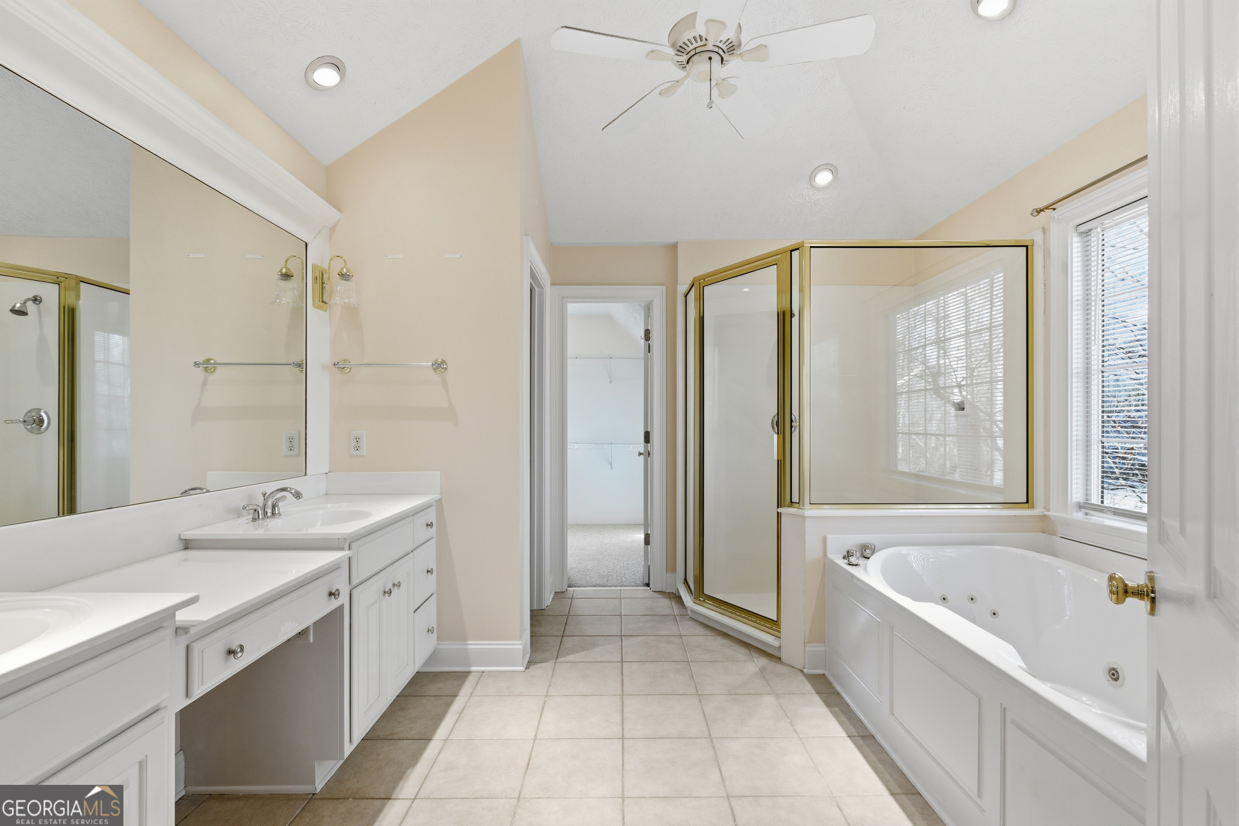 180 Springbrook Drive Cornelia, GA 30531 - Photo 22 of 50 a spacious bathroom with a tub sink shower and mirror