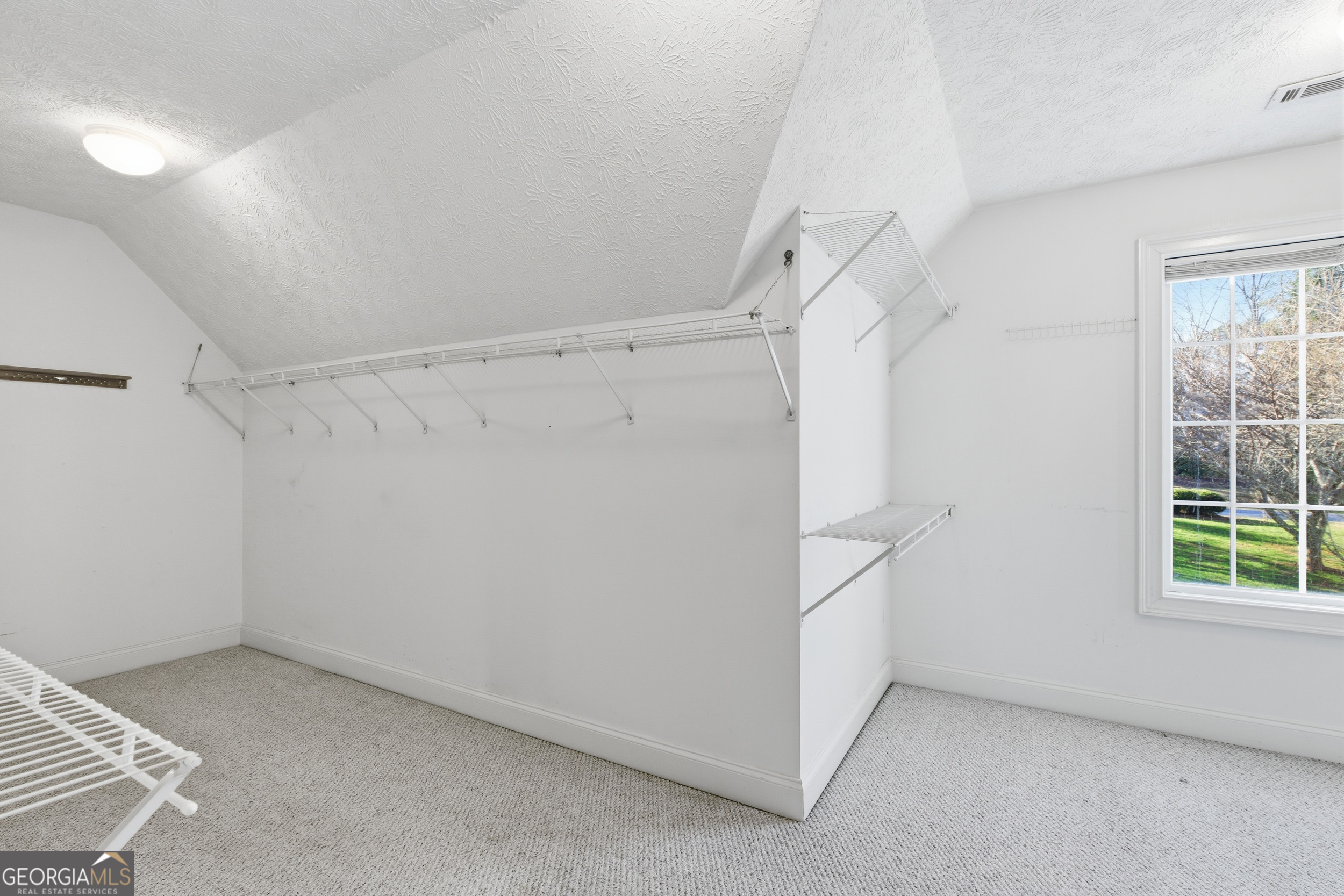 180 Springbrook Drive Cornelia, GA 30531 - Photo 25 of 50 a view of an empty room with a window