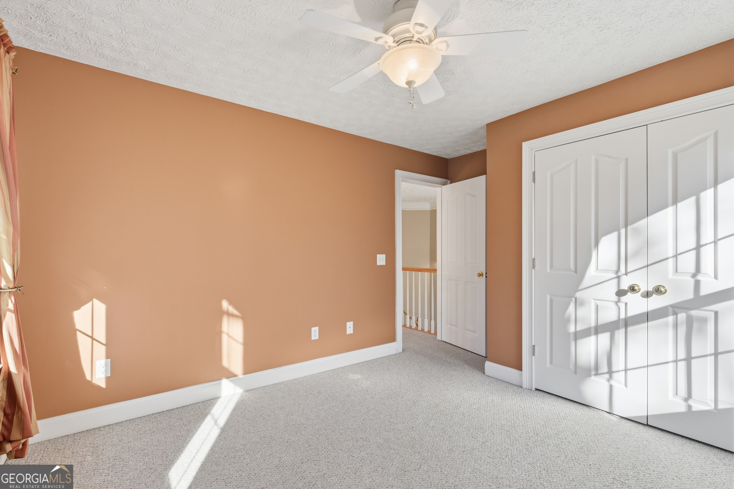180 Springbrook Drive Cornelia, GA 30531 - Photo 33 of 50 a view of a livingroom with a ceiling fan and window