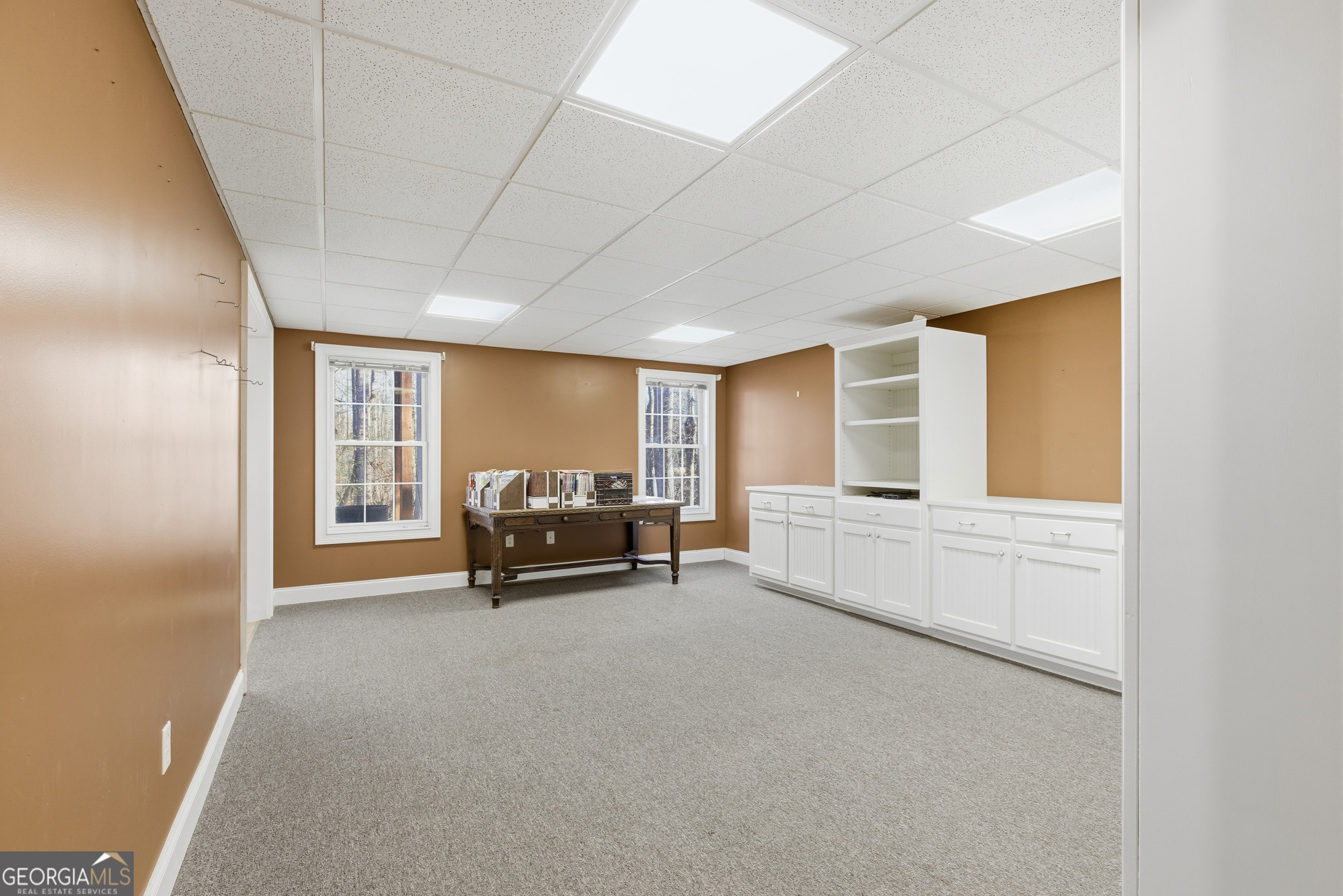 180 Springbrook Drive Cornelia, GA 30531 - Photo 37 of 50 a living room with furniture and a large window
