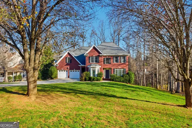 a front view of a house with a yard