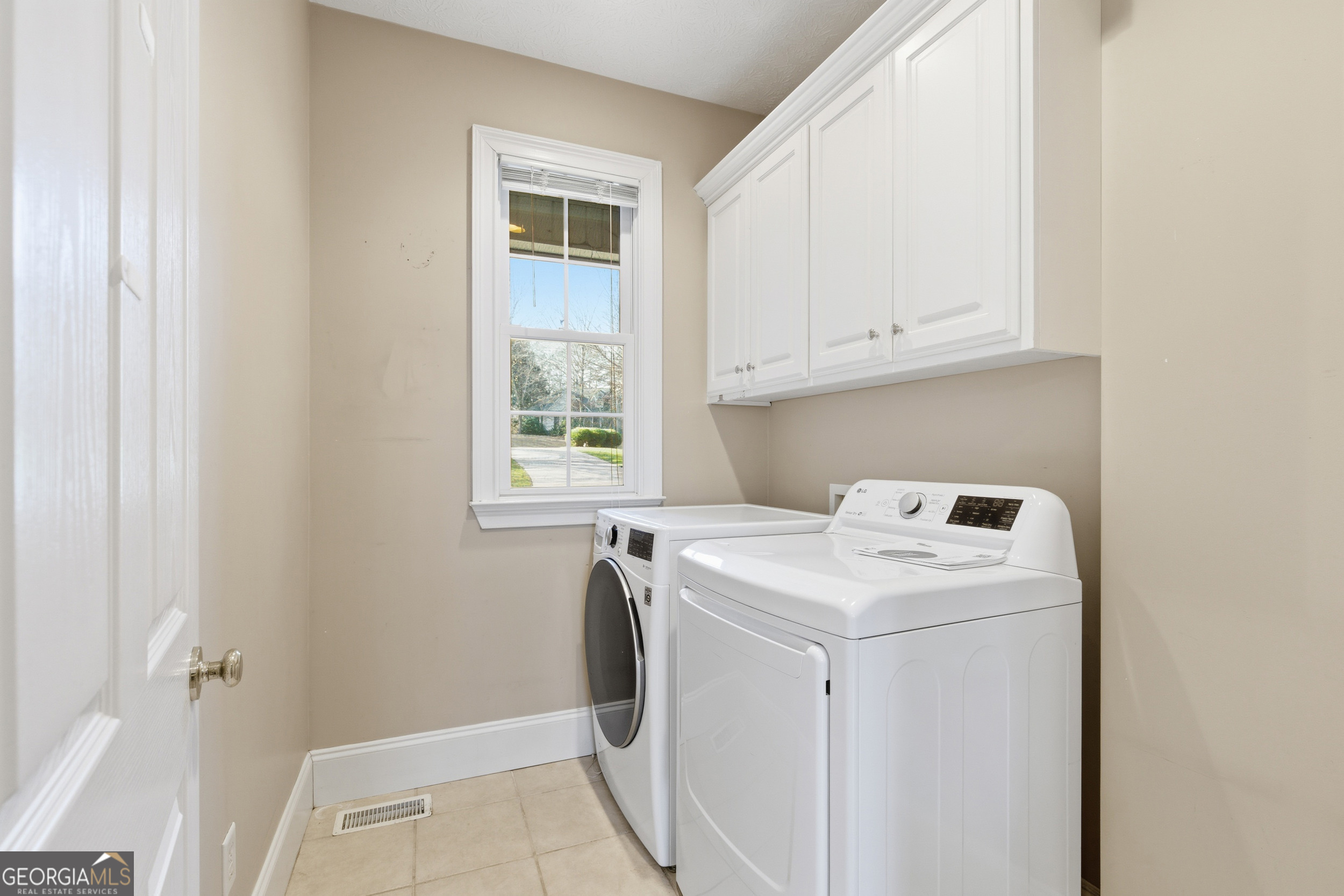 180 Springbrook Drive Cornelia, GA 30531 - Photo 42 of 50 a utility room with dryer and washer