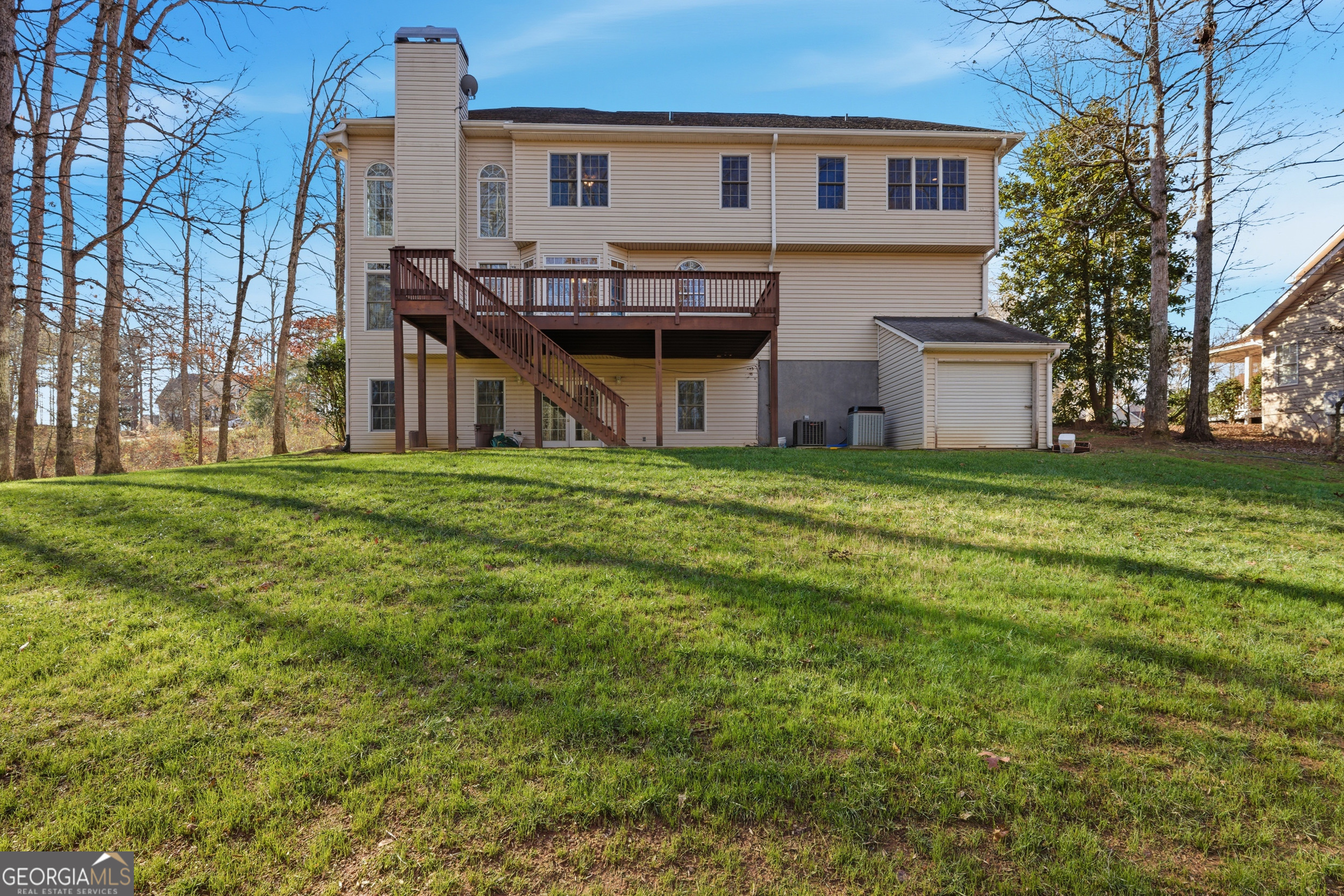 180 Springbrook Drive Cornelia, GA 30531 - Photo 48 of 50 a view of a big house with a big yard and large trees