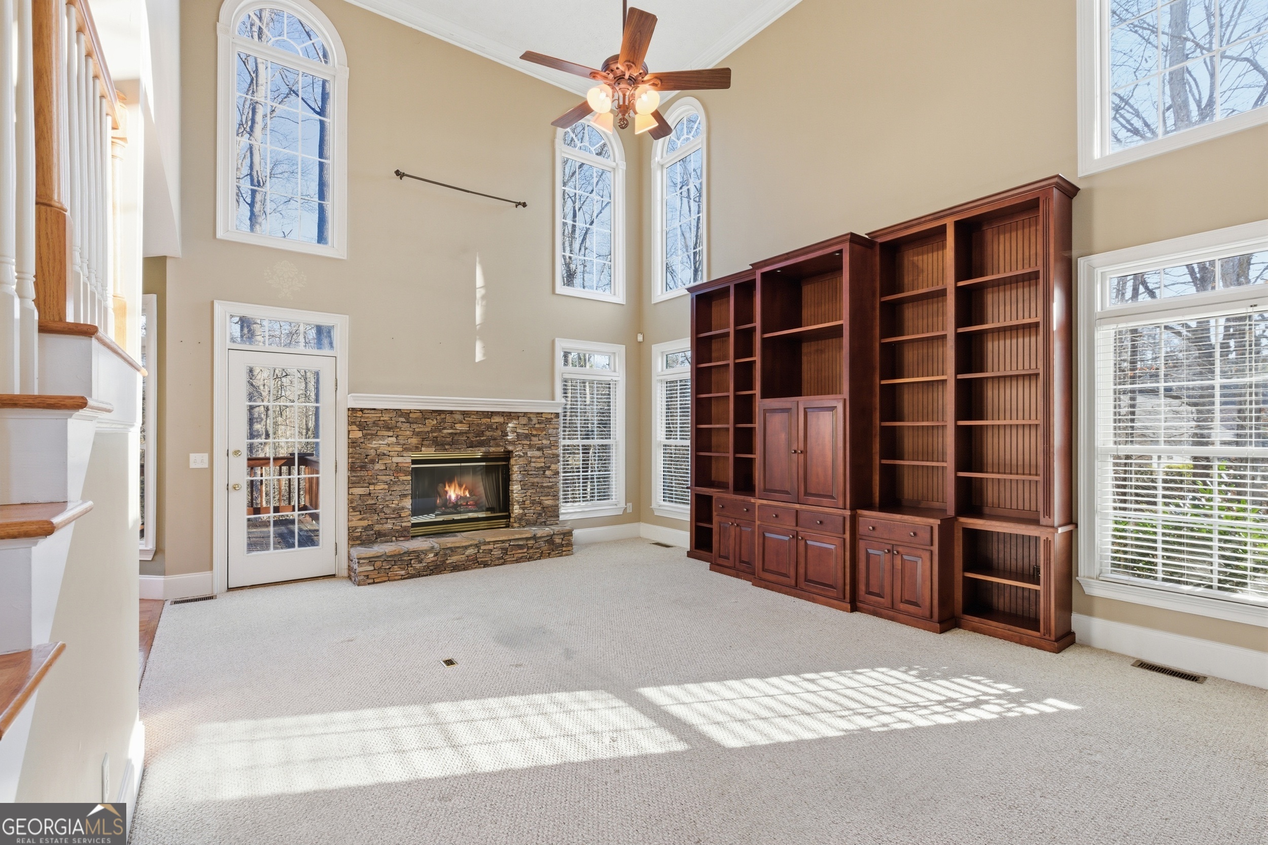 180 Springbrook Drive Cornelia, GA 30531 - Photo 7 of 50 a living room with a fireplace and a large window