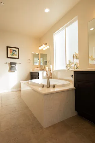 a bedroom with a bed and a mirror