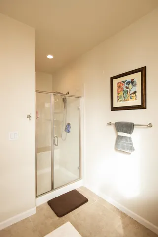 a bathroom with a sink a toilet and shower curtain