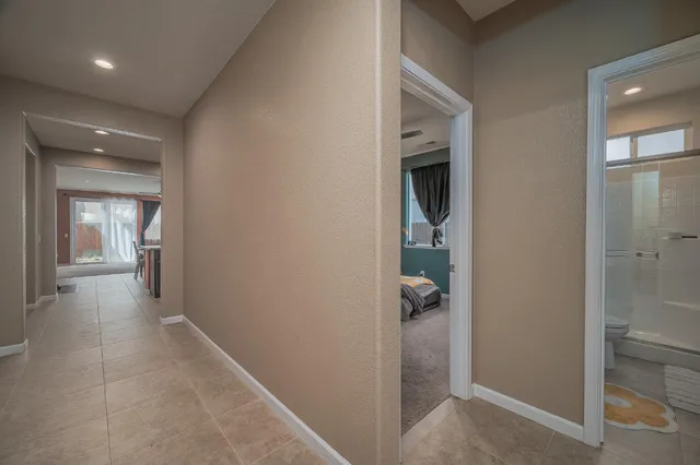 a kitchen with stainless steel appliances granite countertop a stove a sink a refrigerator and a refrigerator