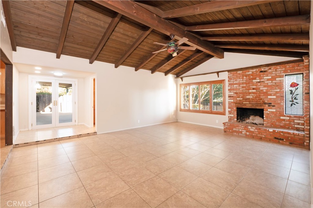 982 River Drive Norco, CA 92860 - Photo 15 of 41 a view of an empty room with a fireplace and a window