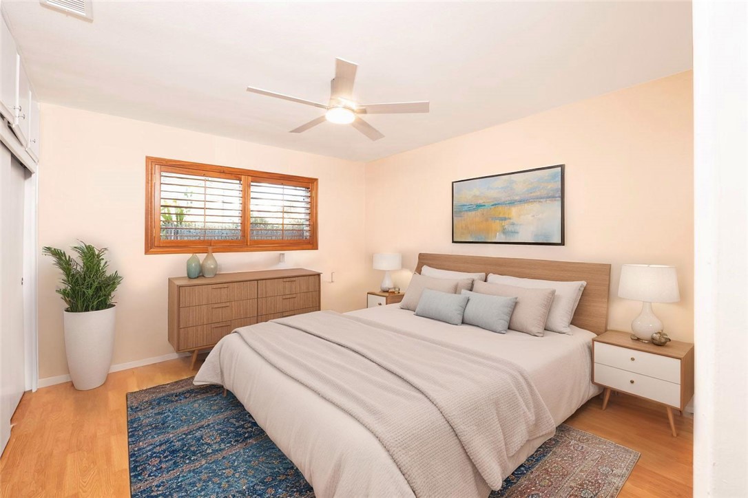 982 River Drive Norco, CA 92860 - Photo 17 of 41 a bedroom with a large bed and a potted plant