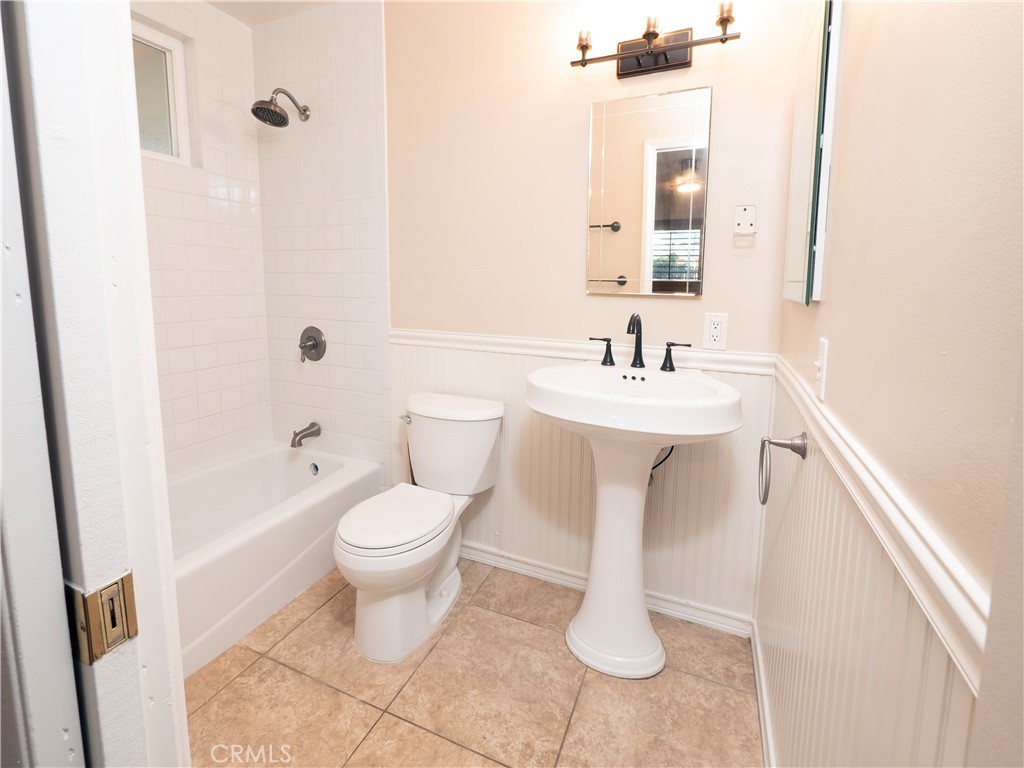 982 River Drive Norco, CA 92860 - Photo 20 of 41 a bathroom with a sink a toilet and shower