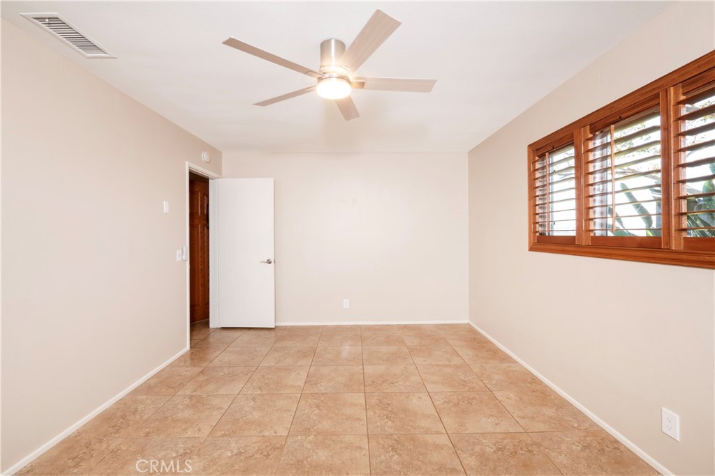 982 River Drive Norco, CA 92860 - Photo 26 of 41 an empty room with fan and windows
