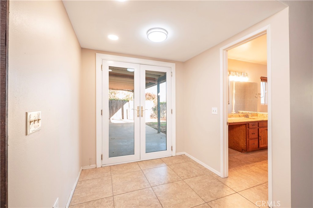 982 River Drive Norco, CA 92860 - Photo 27 of 41 a view of a hallway and an dining rom with furniture