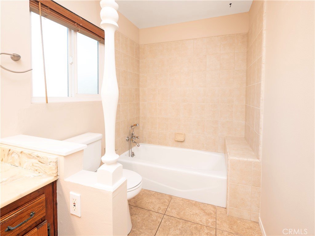 982 River Drive Norco, CA 92860 - Photo 29 of 41 a bathroom with a sink a bathtub and a shower