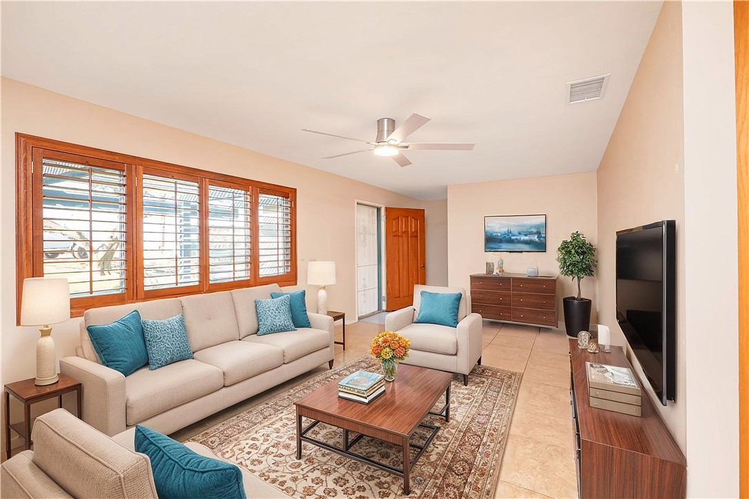 982 River Drive Norco, CA 92860 - Photo 8 of 41 a living room with furniture and a flat screen tv