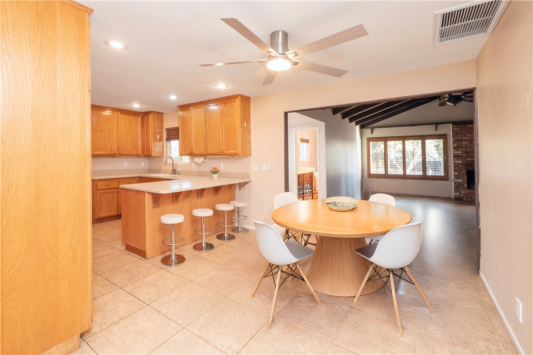 982 River Drive Norco, CA 92860 - Photo 10 of 41 a dining room with a sink a table and chairs
