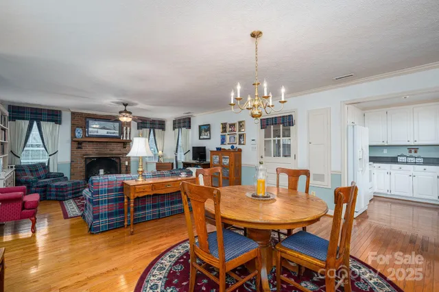 a view of a livingroom with furniture and a fireplace