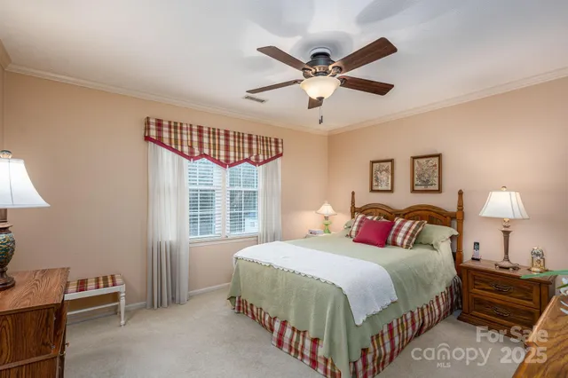 a bedroom with bed and window