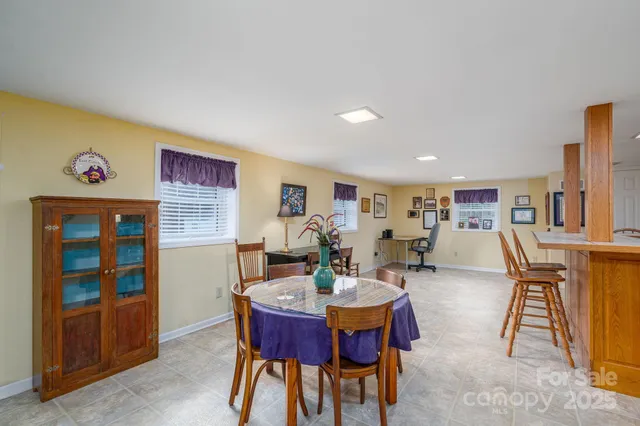 a living room with furniture rug and wooden floor
