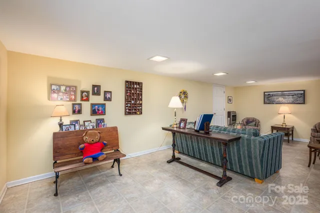 a view of a livingroom with a window and furniture
