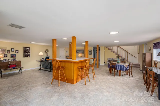 a view of a room with gym equipment and windows