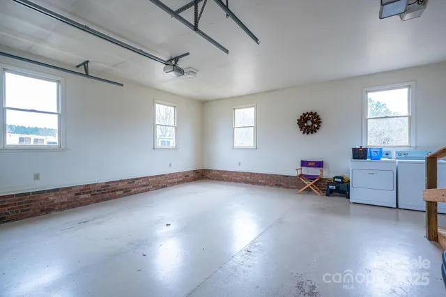 a view of a room with furniture and ceiling fan