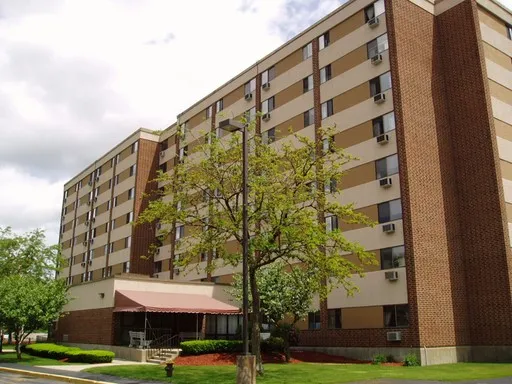 a view of a building with a yard