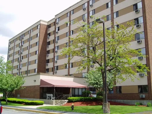 a front view of building with yard