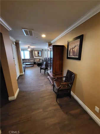 a view of a livingroom with furniture and a flat screen tv