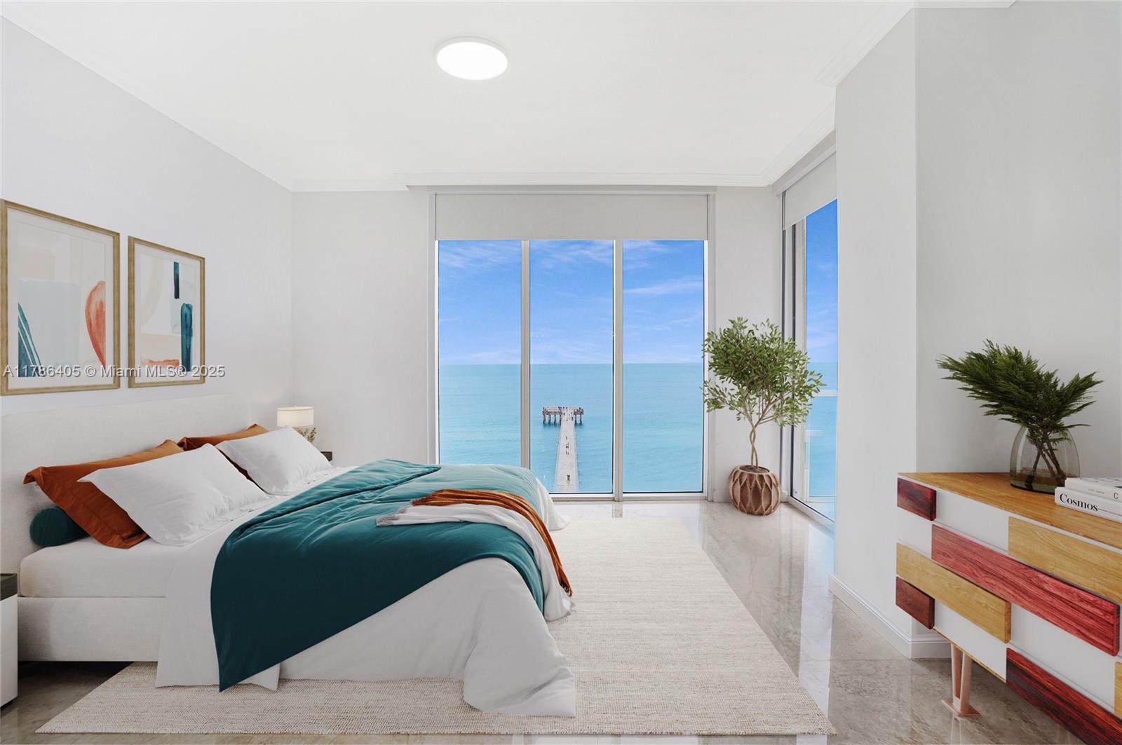 16699 Collins Avenue, Unit 1002 Sunny Isles Beach, FL 33160 - Photo 1 of 38 a bedroom with a bed and a potted plant
