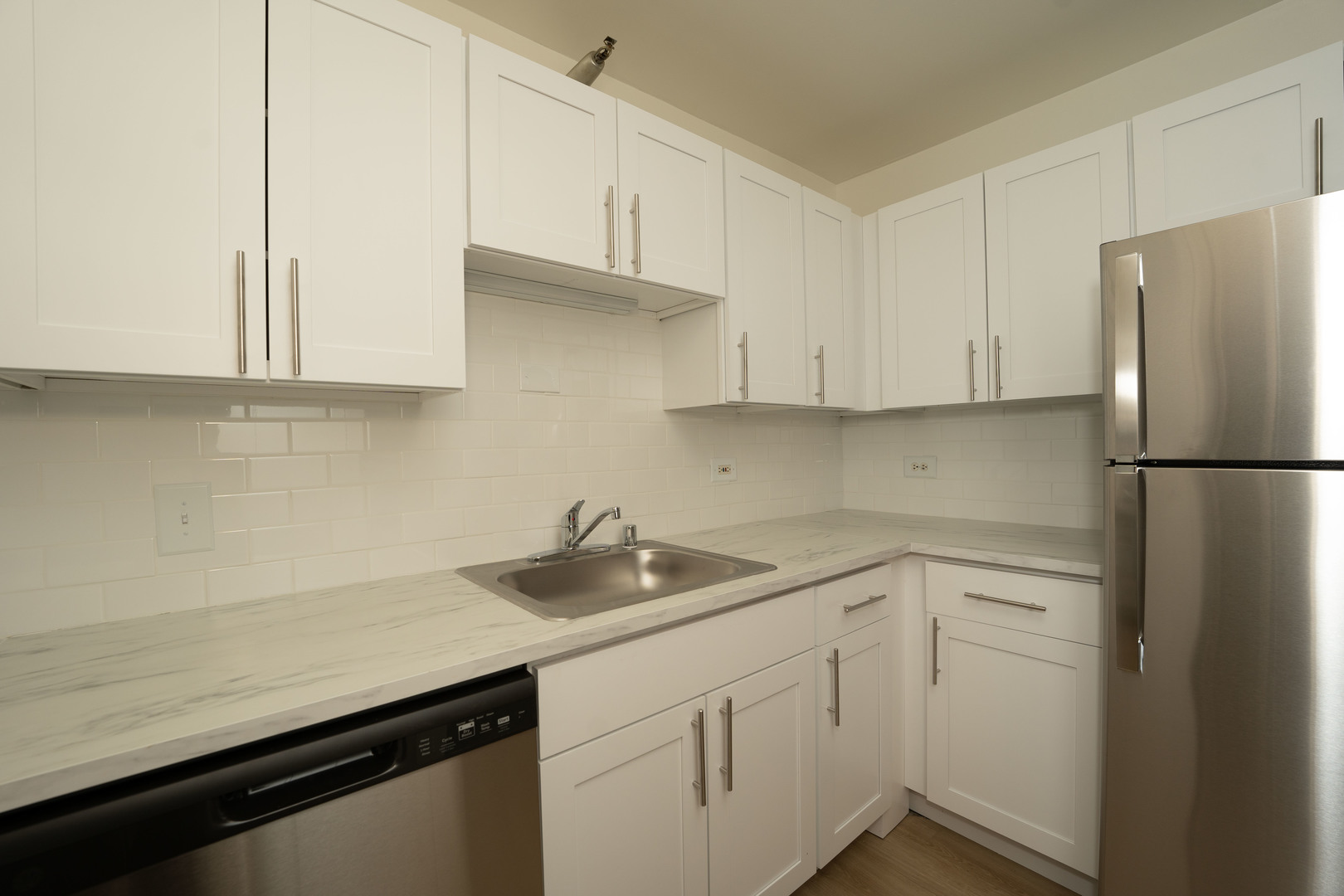1111 North Dearborn Street, Unit 702 Chicago, IL 60610 - Photo 3 of 7 a kitchen with a sink and cabinets