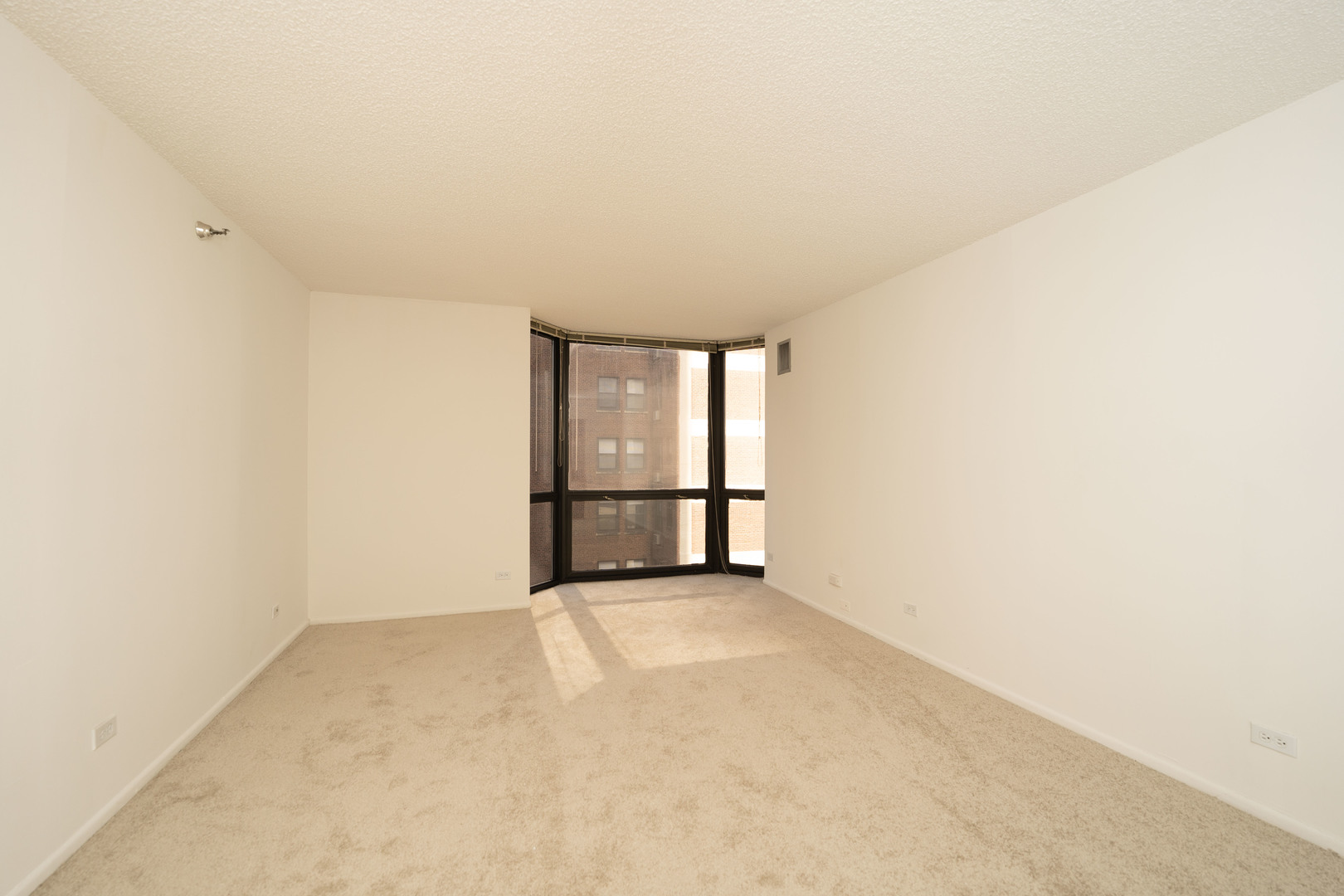 1111 North Dearborn Street, Unit 702 Chicago, IL 60610 - Photo 6 of 7 a view of an empty room with a window