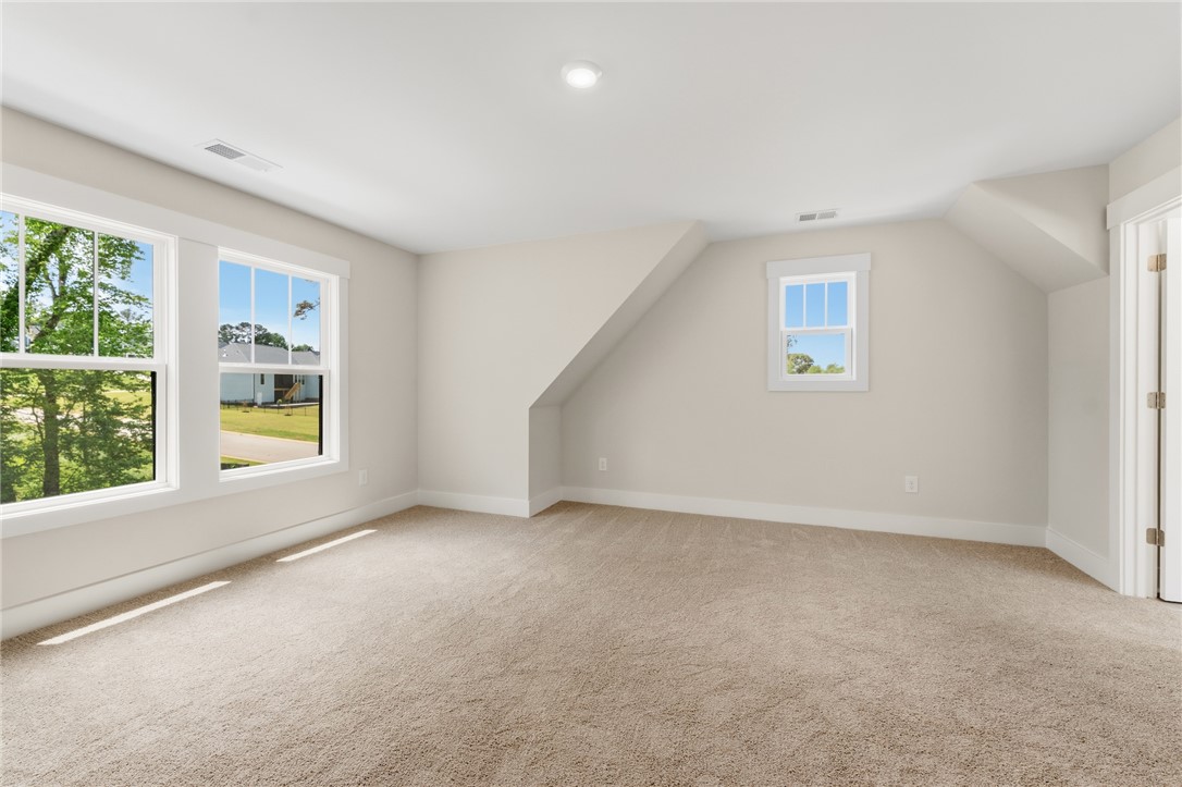 203 Timothy Court Anderson, SC 29621 - Photo 17 of 40 A spacious bedroom offers comfort with soft carpeting and natural light streaming through well-placed windows.