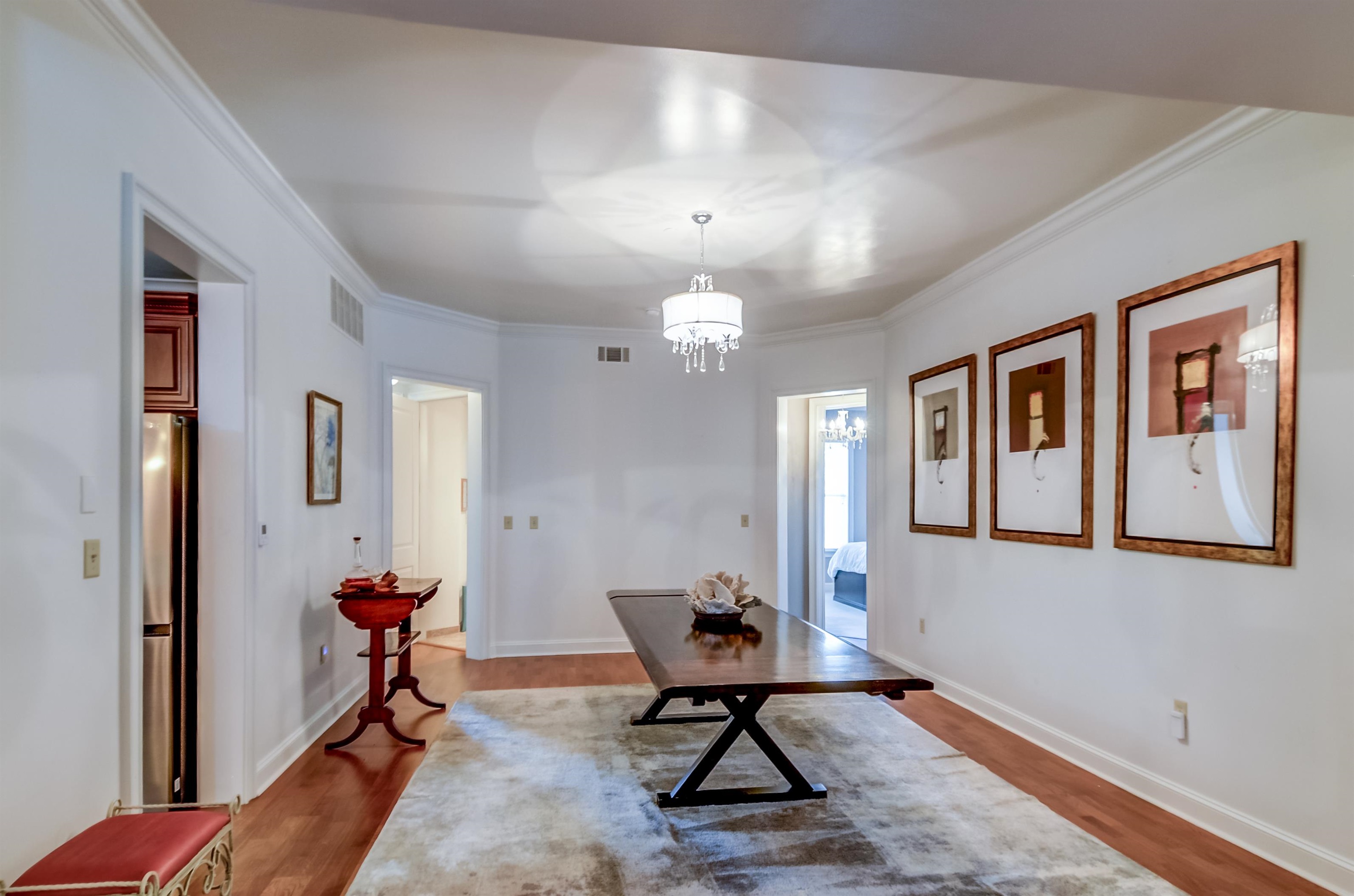 591 Lexington Road, Unit 303 Memphis, TN 38117 - Photo 11 of 34 a very nice looking room with furniture and a chandelier