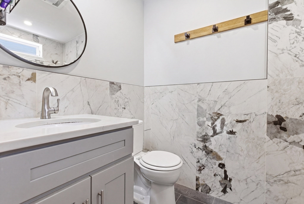 61 Shepton Street Boston, MA 02124 - Photo 19 of 41 a bathroom with a sink and a mirror