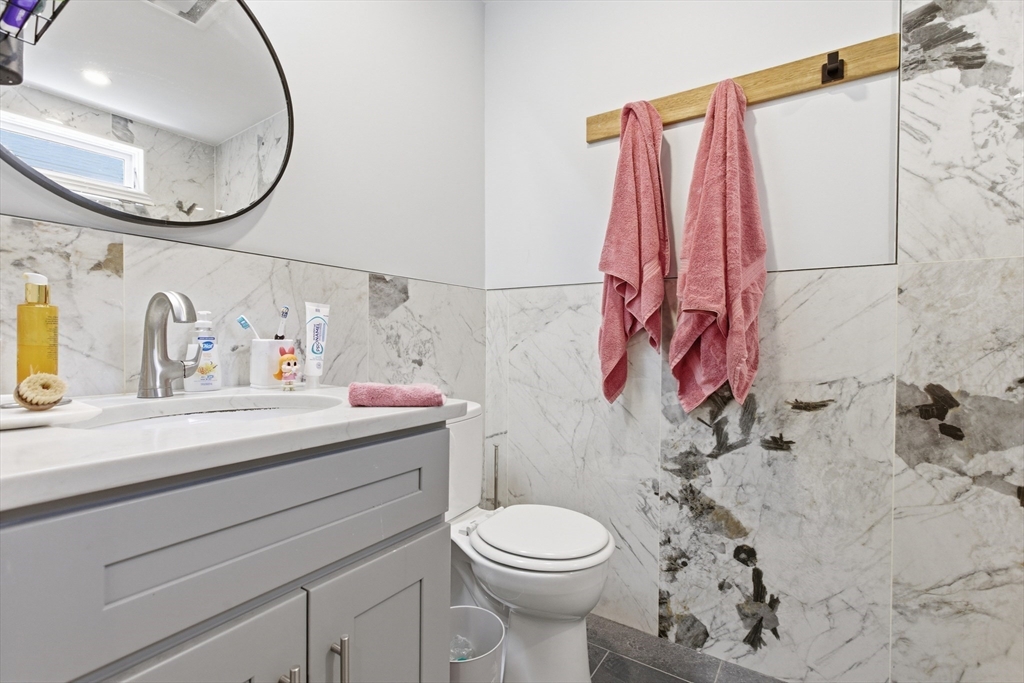 61 Shepton Street Boston, MA 02124 - Photo 20 of 41 a bathroom with a sink and a mirror