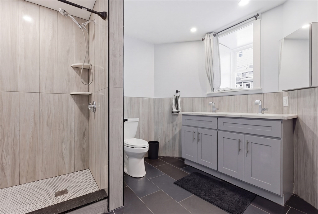 61 Shepton Street Boston, MA 02124 - Photo 22 of 41 a bathroom with a sink toilet and shower