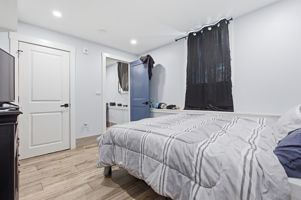 61 Shepton Street Boston, MA 02124 - Photo 28 of 41 a bedroom with a bed and a closet