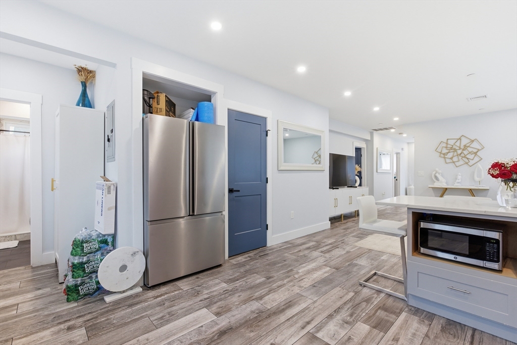 61 Shepton Street Boston, MA 02124 - Photo 34 of 41 a kitchen with granite countertop a refrigerator and a stove