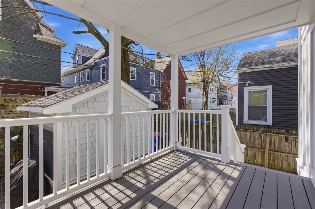 61 Shepton Street Boston, MA 02124 - Photo 38 of 41 a view of a house with a wooden deck