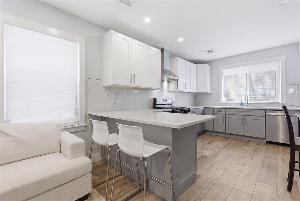 61 Shepton Street Boston, MA 02124 - Photo 9 of 41 a kitchen with a sink cabinets and window