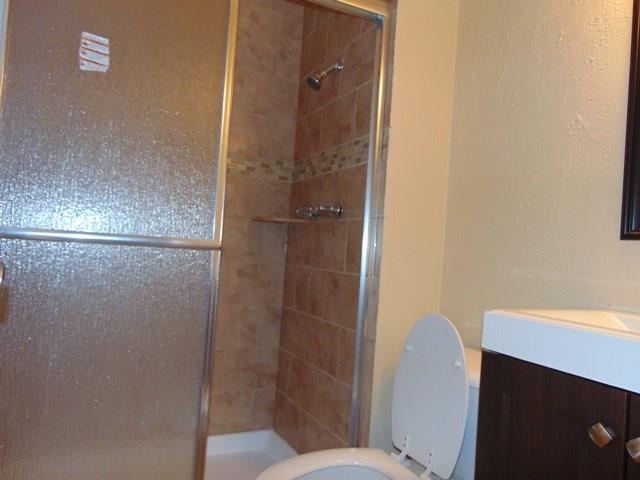 1201 Rambler Road Arlington, TX 76014 - Photo 14 of 15 a bathroom with a shower and toilet