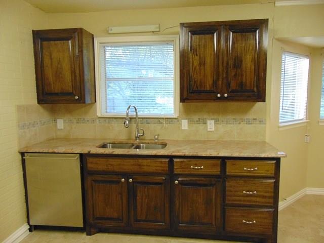 1201 Rambler Road Arlington, TX 76014 - Photo 6 of 15 a bathroom with a sink a vanity and a mirror
