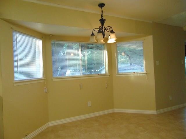 1201 Rambler Road Arlington, TX 76014 - Photo 8 of 15 a view of a room with a window and chandelier