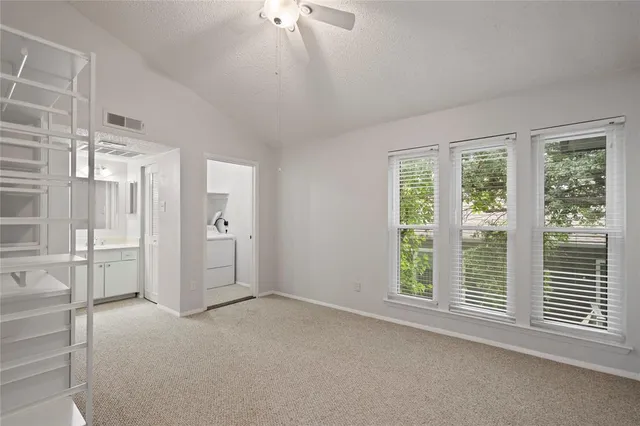 a view of empty room with windows