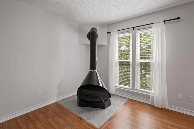 a room with a window and wooden floor
