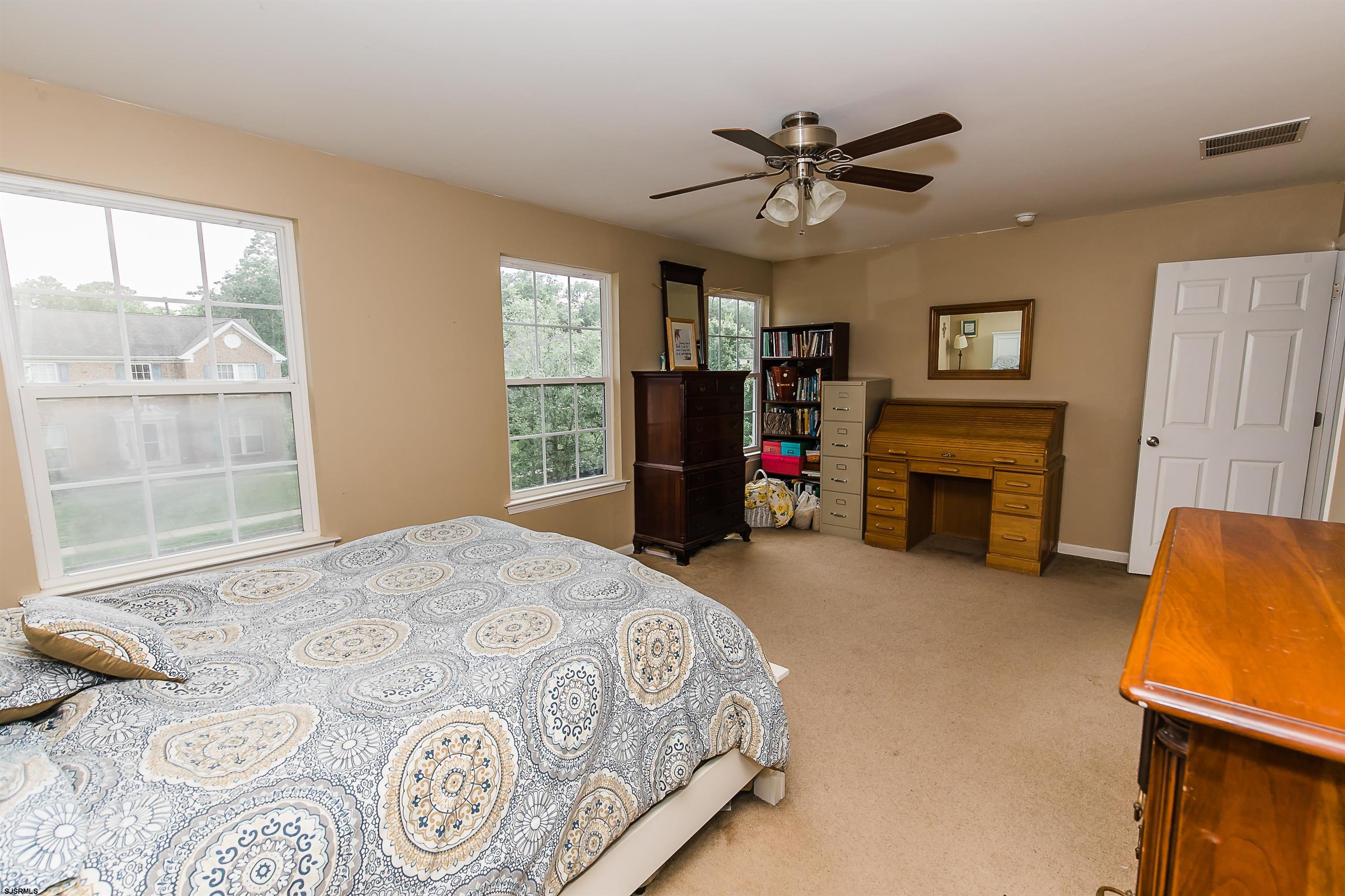 16 Cottage Road Egg Harbor Township, NJ 08234 - Photo 13 of 24 a bed room with a bed and a television