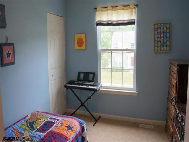 16 Cottage Road Egg Harbor Township, NJ 08234 - Photo 16 of 24 a bedroom with a bed and a window