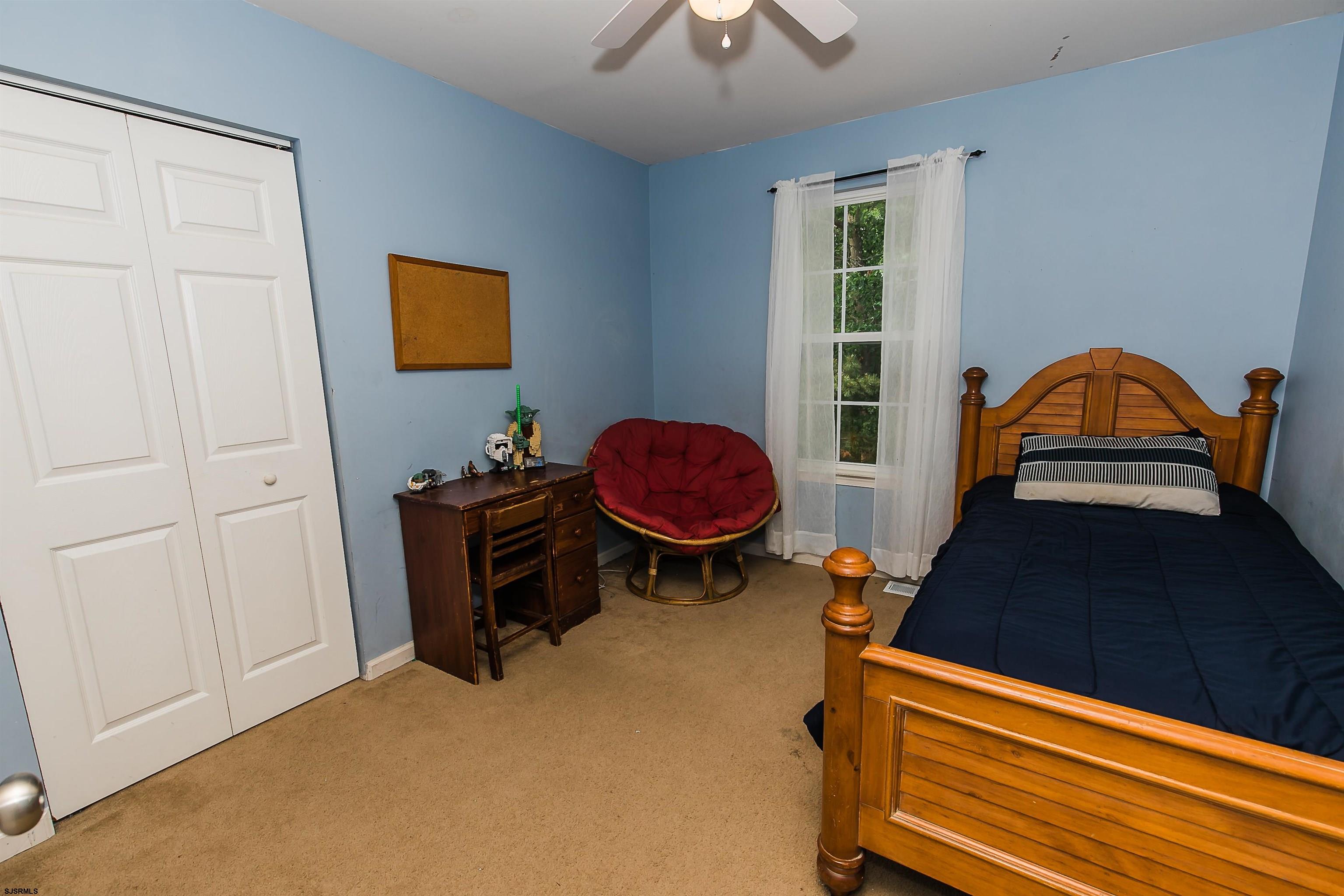 16 Cottage Road Egg Harbor Township, NJ 08234 - Photo 18 of 24 a bed room with a bed and a window