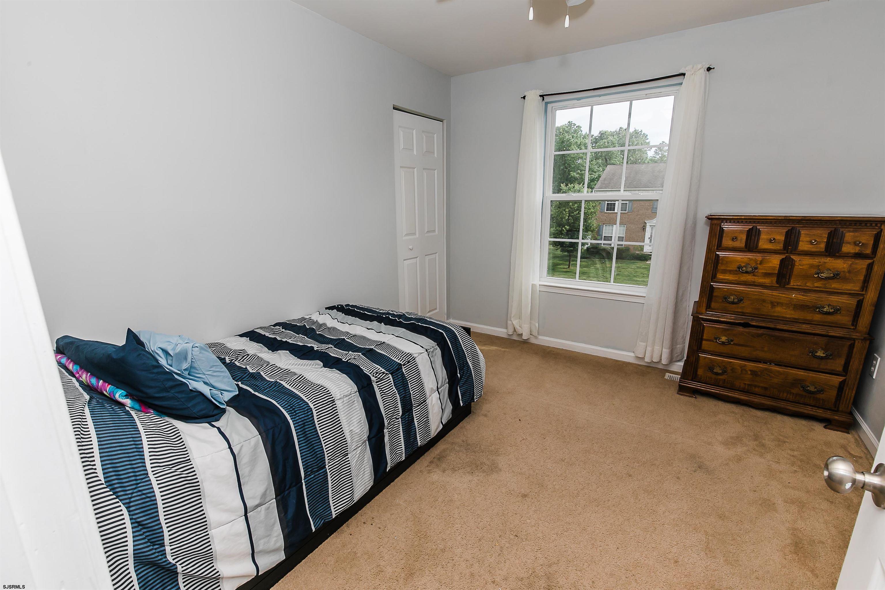 16 Cottage Road Egg Harbor Township, NJ 08234 - Photo 19 of 24 a bedroom with a bed and a window