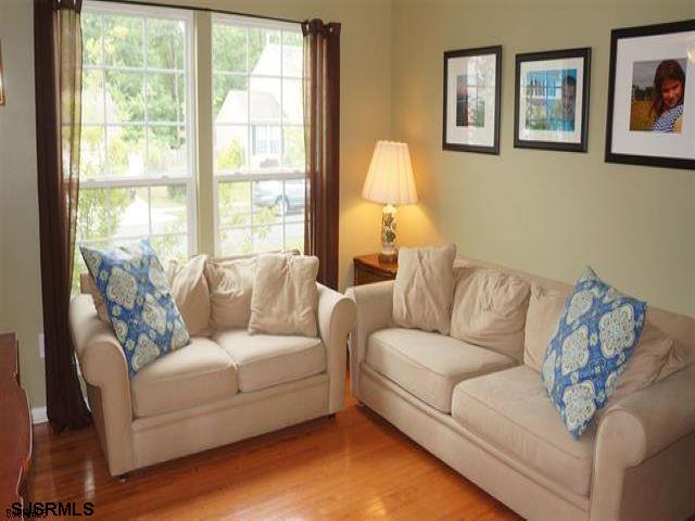 16 Cottage Road Egg Harbor Township, NJ 08234 - Photo 2 of 24 a living room with furniture and a large window